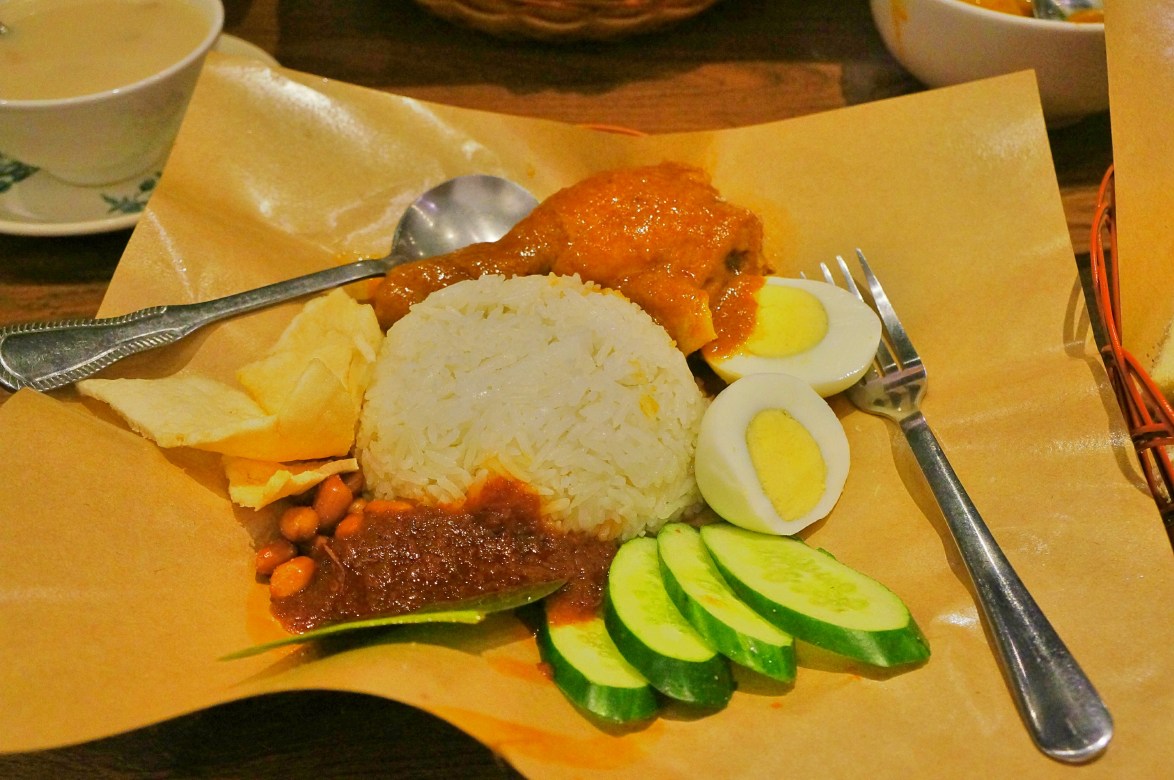 spicy chicken with rice, eggs, and shrimp crackers